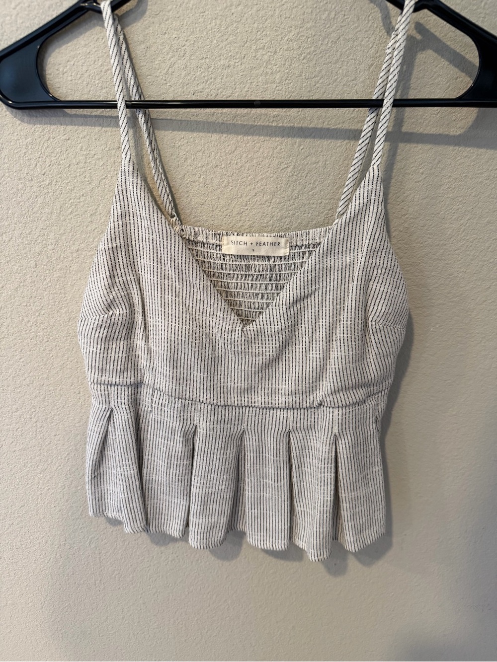Stitch and feather tank